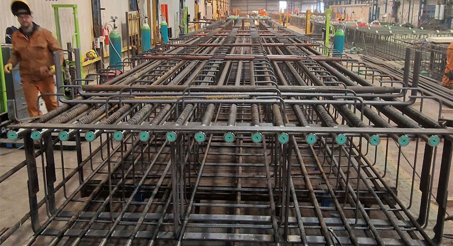 Steel structure for building construction featuring a diaphragm wall, showcasing the framework and support elements.